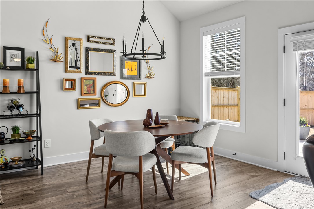 135 Bowers Estates Road Hartwell, GA 30643 - Photo 12 of 35 This bright dining area features an elegant light fixture and ample natural light, perfect for meals and gatherings.