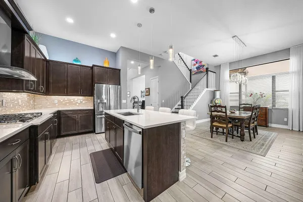 a kitchen with a sink and wooden cabinets