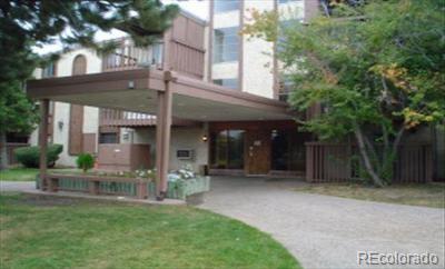 1302 South Parker Road, Unit 216 Denver, CO 80231 - Photo 1 of 13 a view of a house with a yard and porch