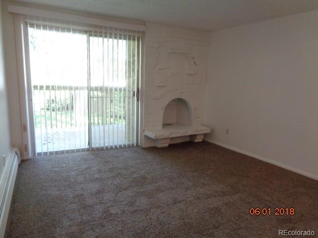 1302 South Parker Road, Unit 216 Denver, CO 80231 - Photo 3 of 13 a view of an empty room with a balcony
