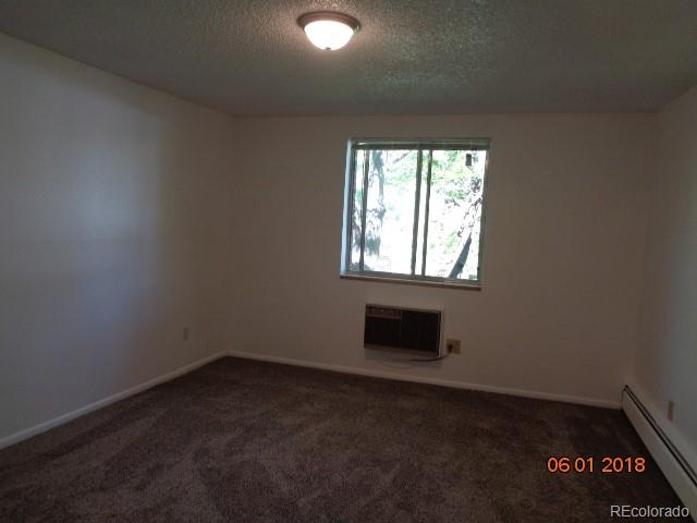 1302 South Parker Road, Unit 216 Denver, CO 80231 - Photo 5 of 13 an empty room with a window