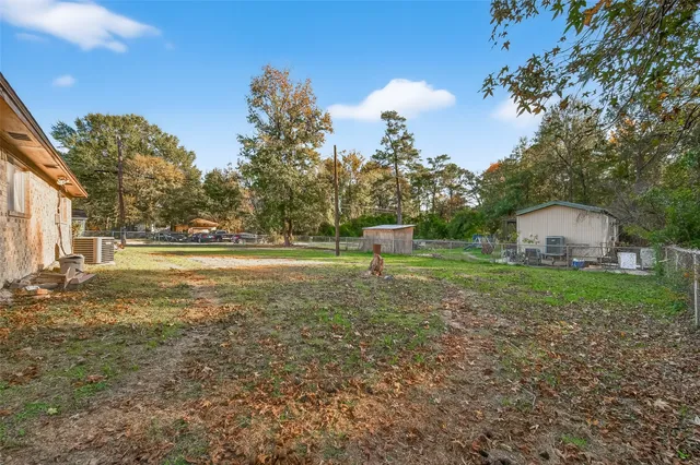 a view of outdoor space with deck and yard