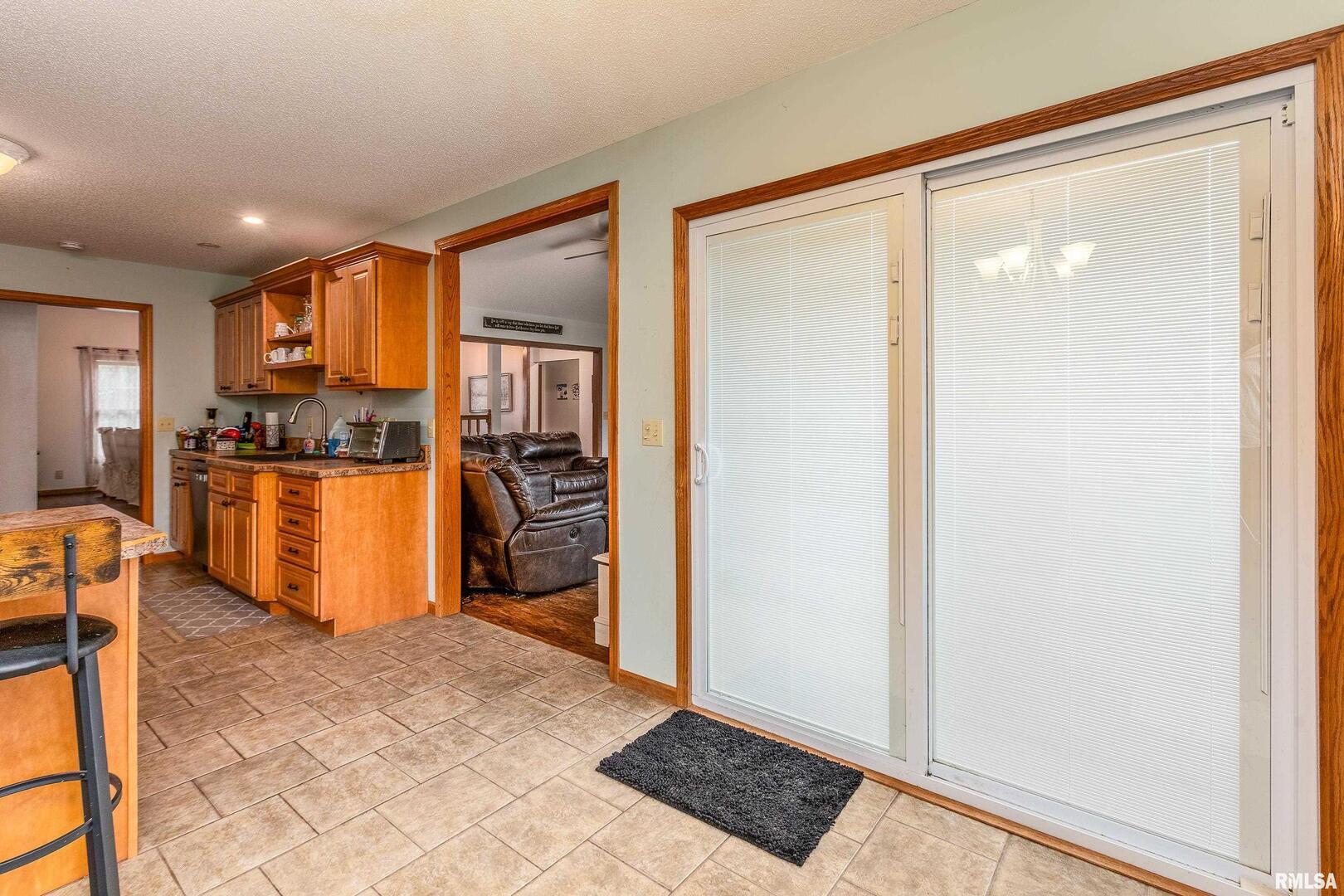 186 Bonnie Brae Road Carbondale, IL 62901 - Photo 13 of 47 a view of a kitchen with refrigerator and wooden floor