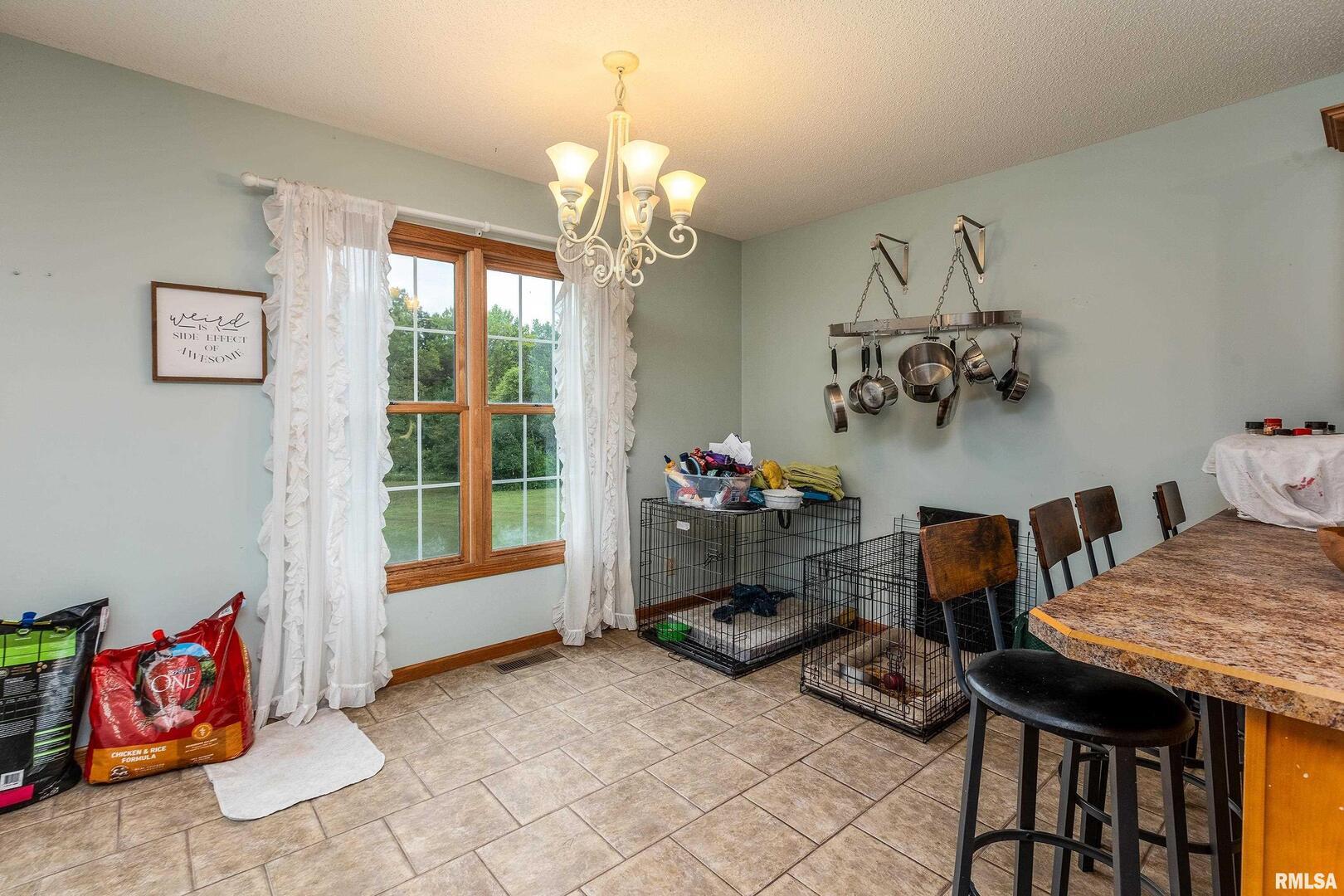 186 Bonnie Brae Road Carbondale, IL 62901 - Photo 14 of 47 a view of a dining room with furniture and chandelier