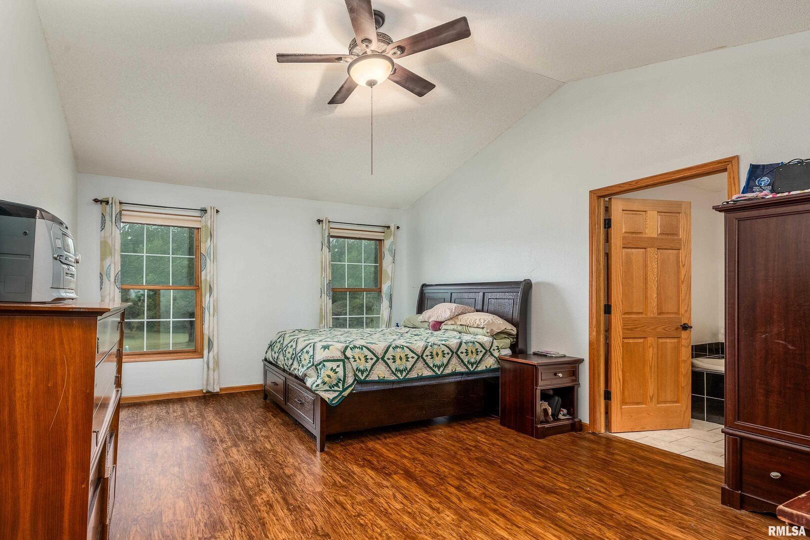 186 Bonnie Brae Road Carbondale, IL 62901 - Photo 15 of 47 a bedroom with a bed and a window