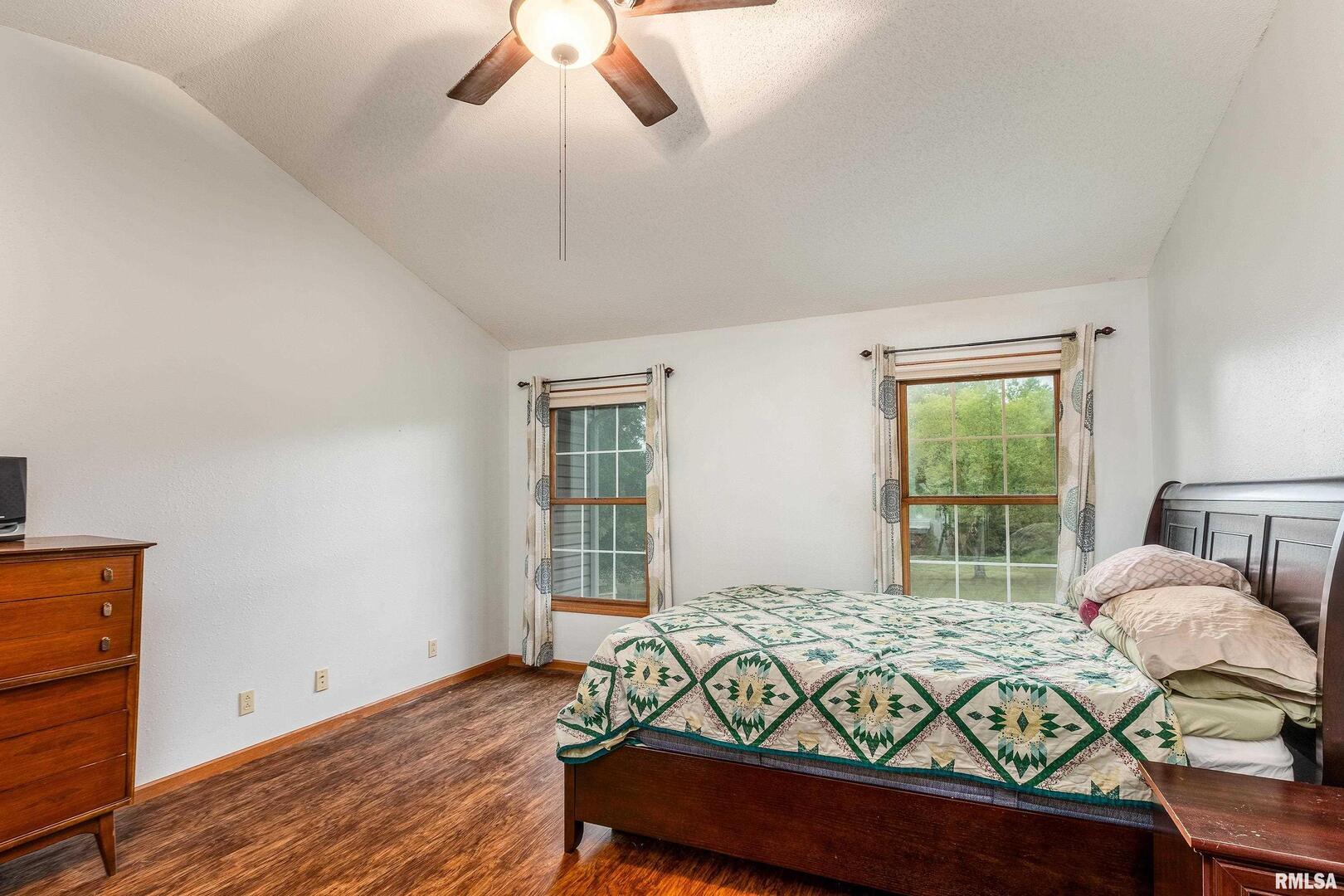 186 Bonnie Brae Road Carbondale, IL 62901 - Photo 16 of 47 a bedroom with a bed and wooden floor