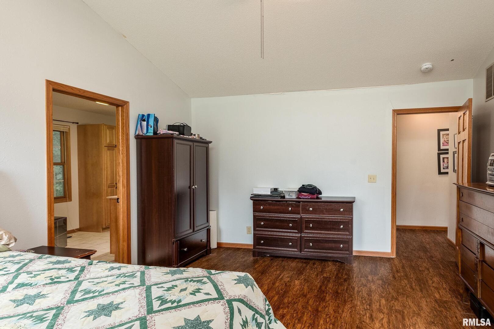 186 Bonnie Brae Road Carbondale, IL 62901 - Photo 17 of 47 a bedroom with a bed and a mirror