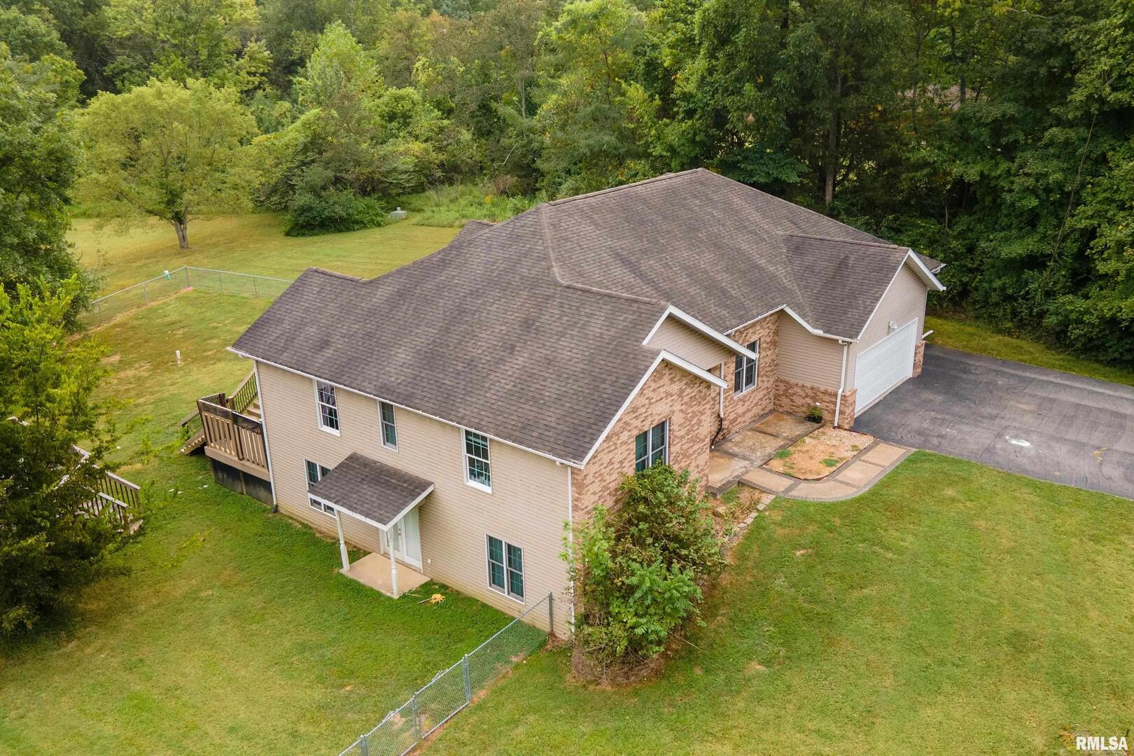 186 Bonnie Brae Road Carbondale, IL 62901 - Photo 45 of 47 an aerial view of a house with a yard basket ball court and outdoor seating