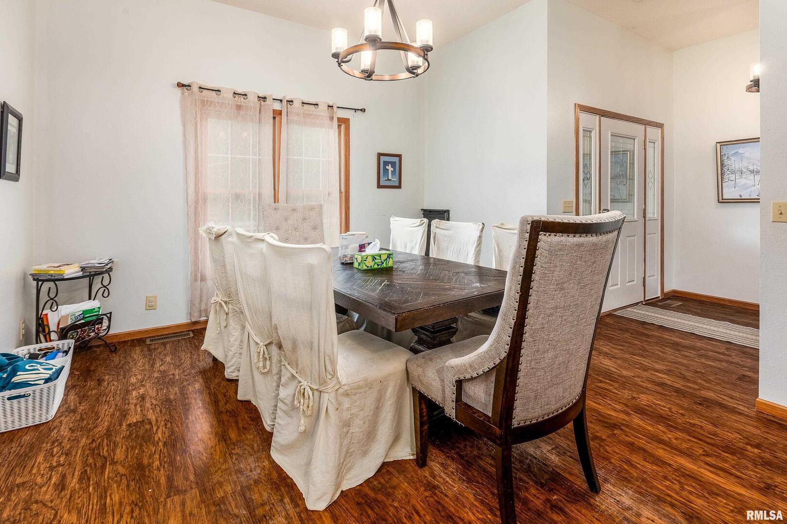 186 Bonnie Brae Road Carbondale, IL 62901 - Photo 6 of 47 a view of a dining room with furniture window and wooden floor