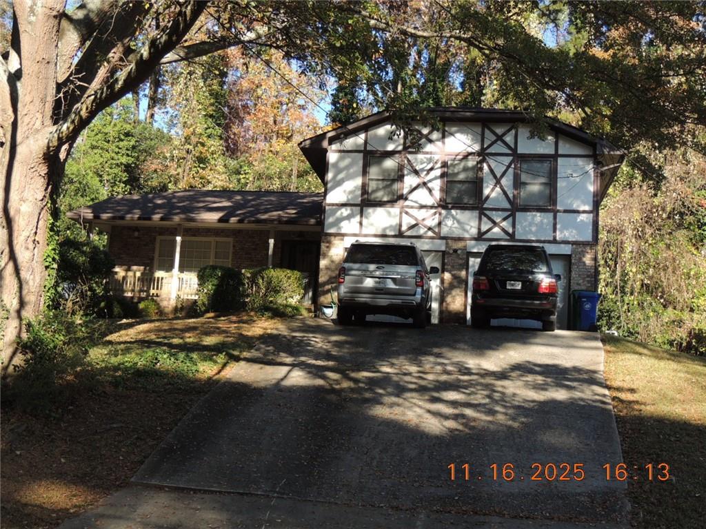 a view of a car park in front of house
