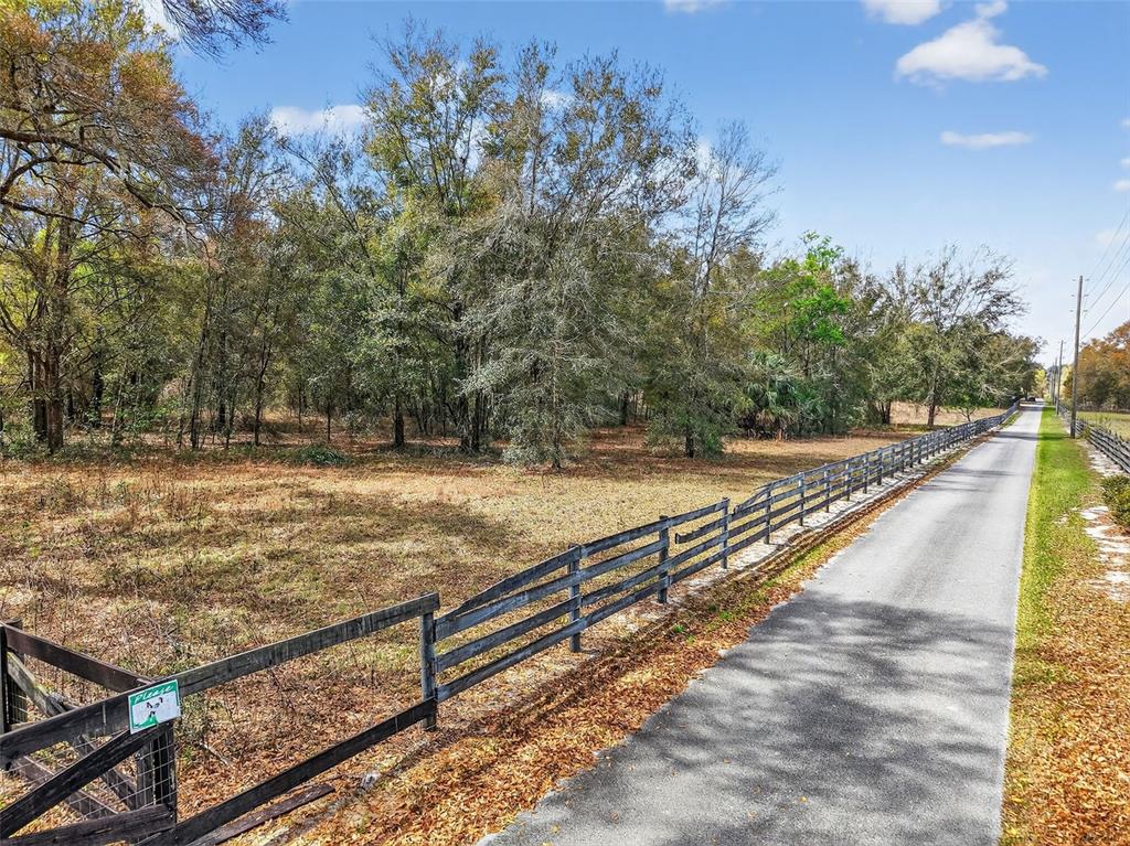 3800 Double D Circle R Lady Lake, FL 32159 - Photo 2 of 6 a view of a swimming pool with a patio