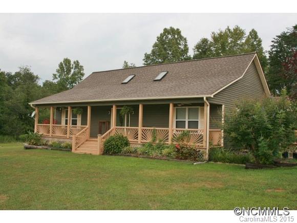 2136 Coopers Gap Road Rutherfordton, NC 28139 - Photo 1 of 24 a front view of a house with garden