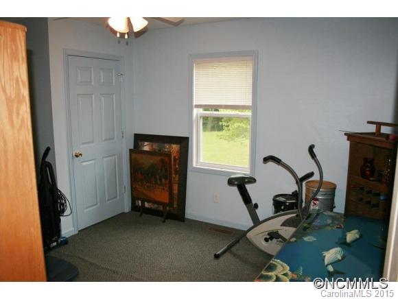 2136 Coopers Gap Road Rutherfordton, NC 28139 - Photo 11 of 24 a view of a workspace with furniture and a window