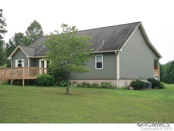 2136 Coopers Gap Road Rutherfordton, NC 28139 - Photo 13 of 24 a backyard of a house with potted plants and large tree