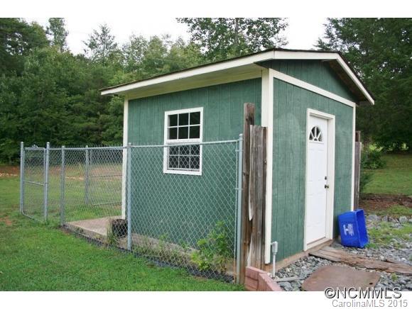 2136 Coopers Gap Road Rutherfordton, NC 28139 - Photo 15 of 24 a front view of a house with garden