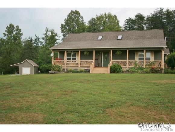 2136 Coopers Gap Road Rutherfordton, NC 28139 - Photo 22 of 24 a front view of a house with a garden