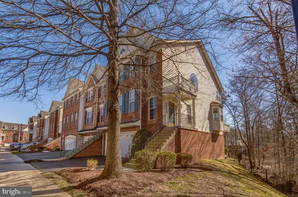 a view of entryway with wooden floor and windows