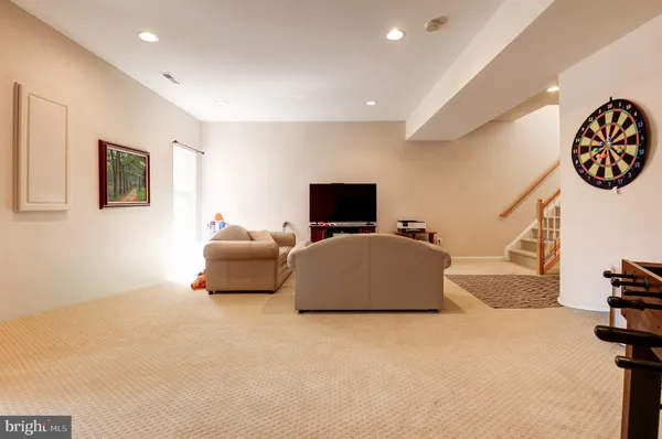 a view of a livingroom with furniture and a window