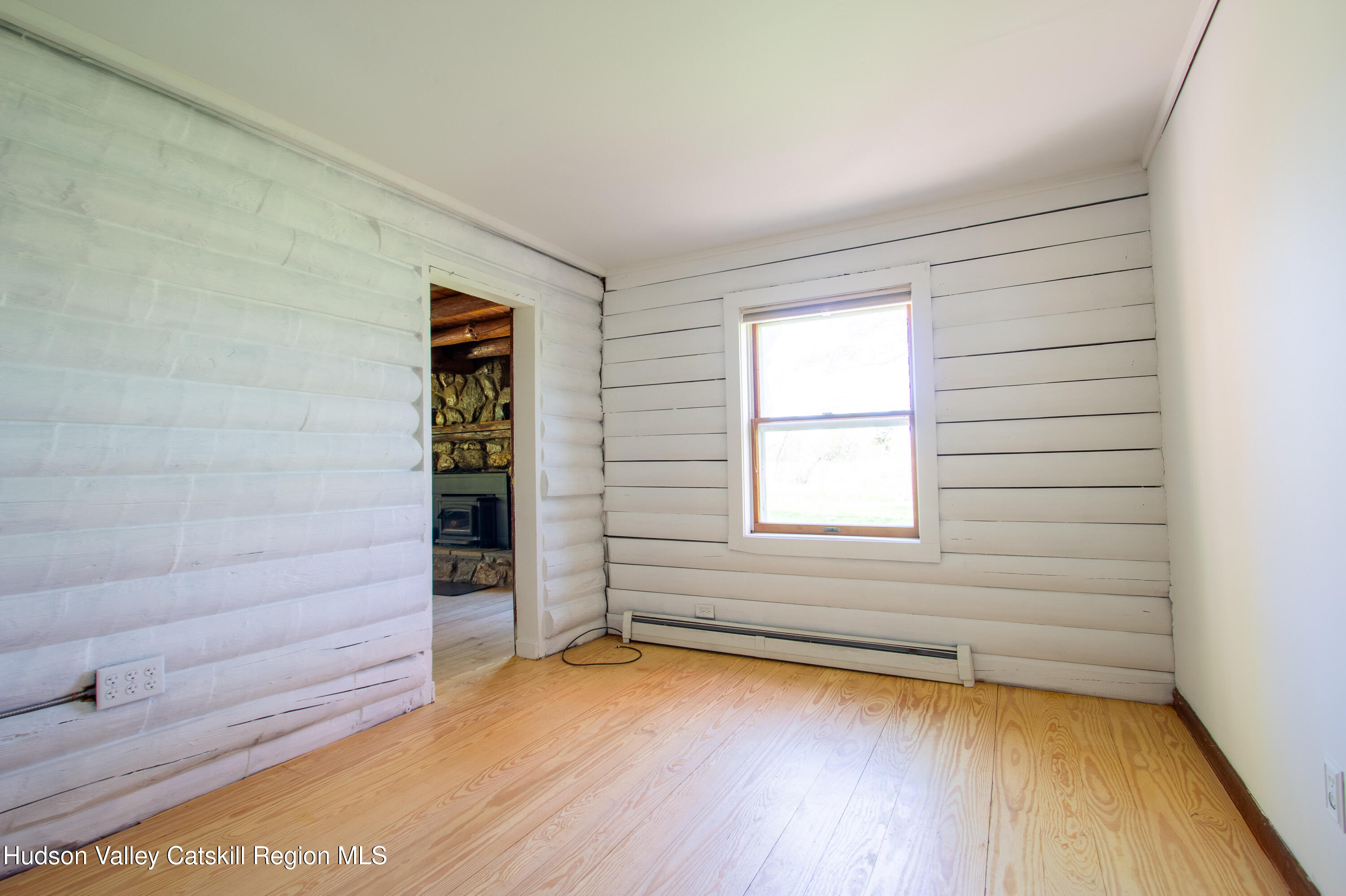 205 Fordham Road Valatie, NY 12184 - Photo 6 of 18 wooden floor in an empty room with a window