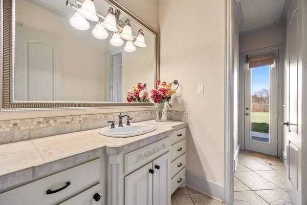 a bathroom with a sink and a mirror
