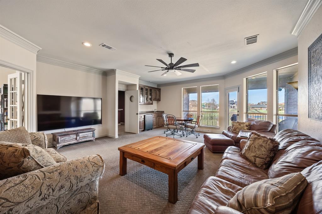 530 Ridge Point Drive Heath, TX 75126 - Photo 20 of 39 Upstairs game room with wet bar and views of the property.