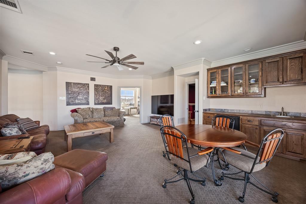 530 Ridge Point Drive Heath, TX 75126 - Photo 21 of 39 Upstairs game room with wet bar.