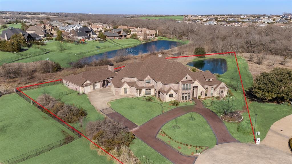 530 Ridge Point Drive Heath, TX 75126 - Photo 3 of 39 Aerial view showing approximate property lines and the pond on the property.