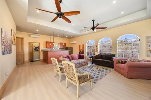 a living room with lots of furniture and a chandelier