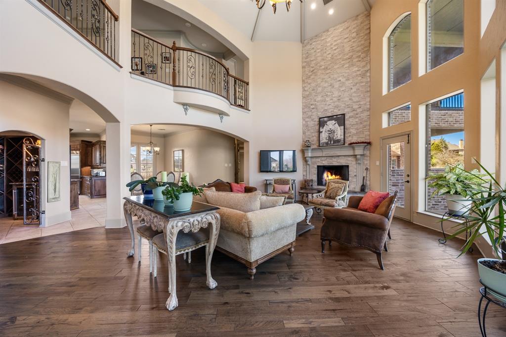 530 Ridge Point Drive Heath, TX 75126 - Photo 7 of 39 Living room with amazing windows overlooking the property and soaring ceailings.