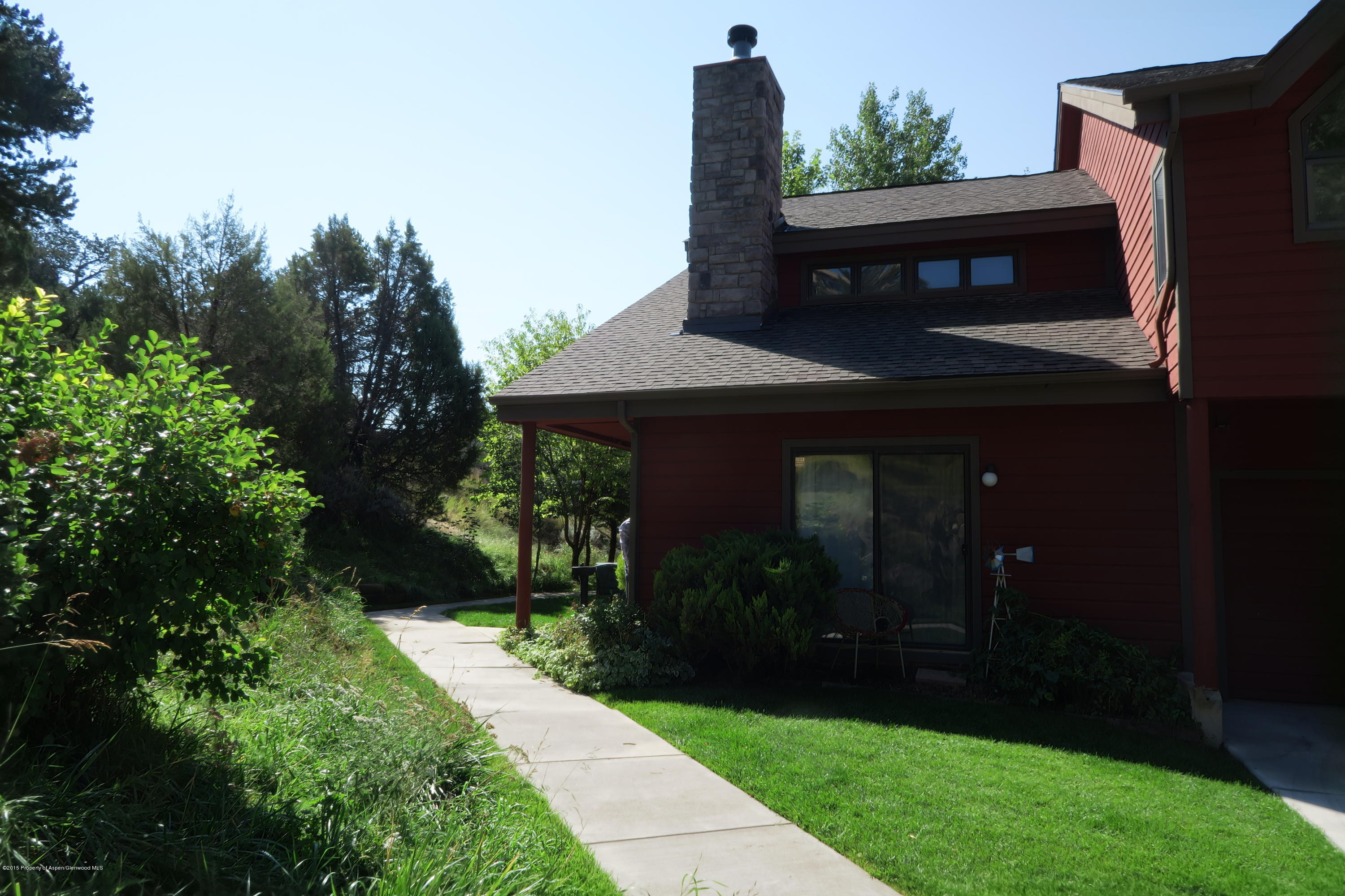 105 Silverado Drive Basalt, CO 81621 - Photo 1 of 13 a front view of house with yard and green space