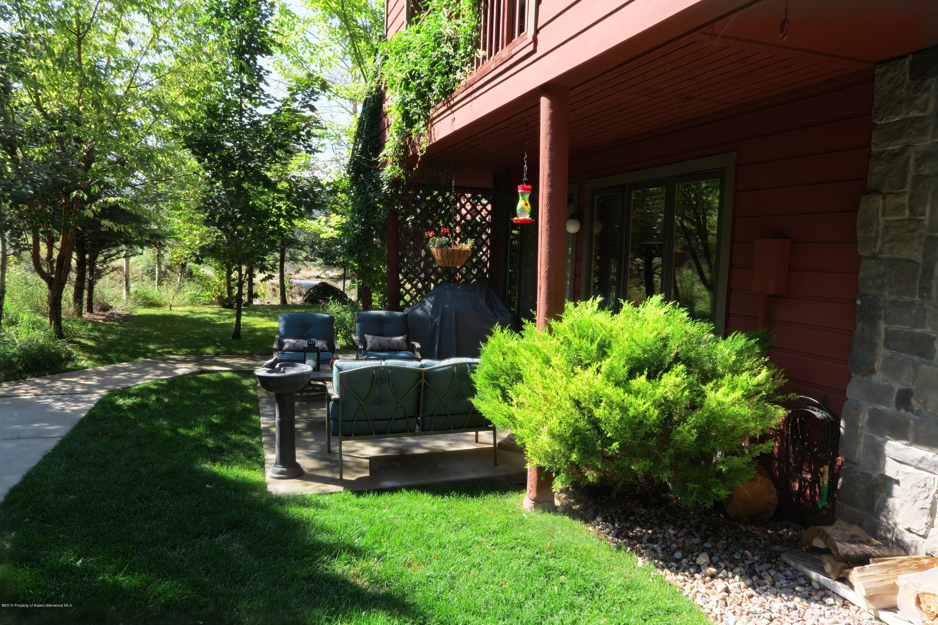 105 Silverado Drive Basalt, CO 81621 - Photo 4 of 13 a garden with trees in front of it