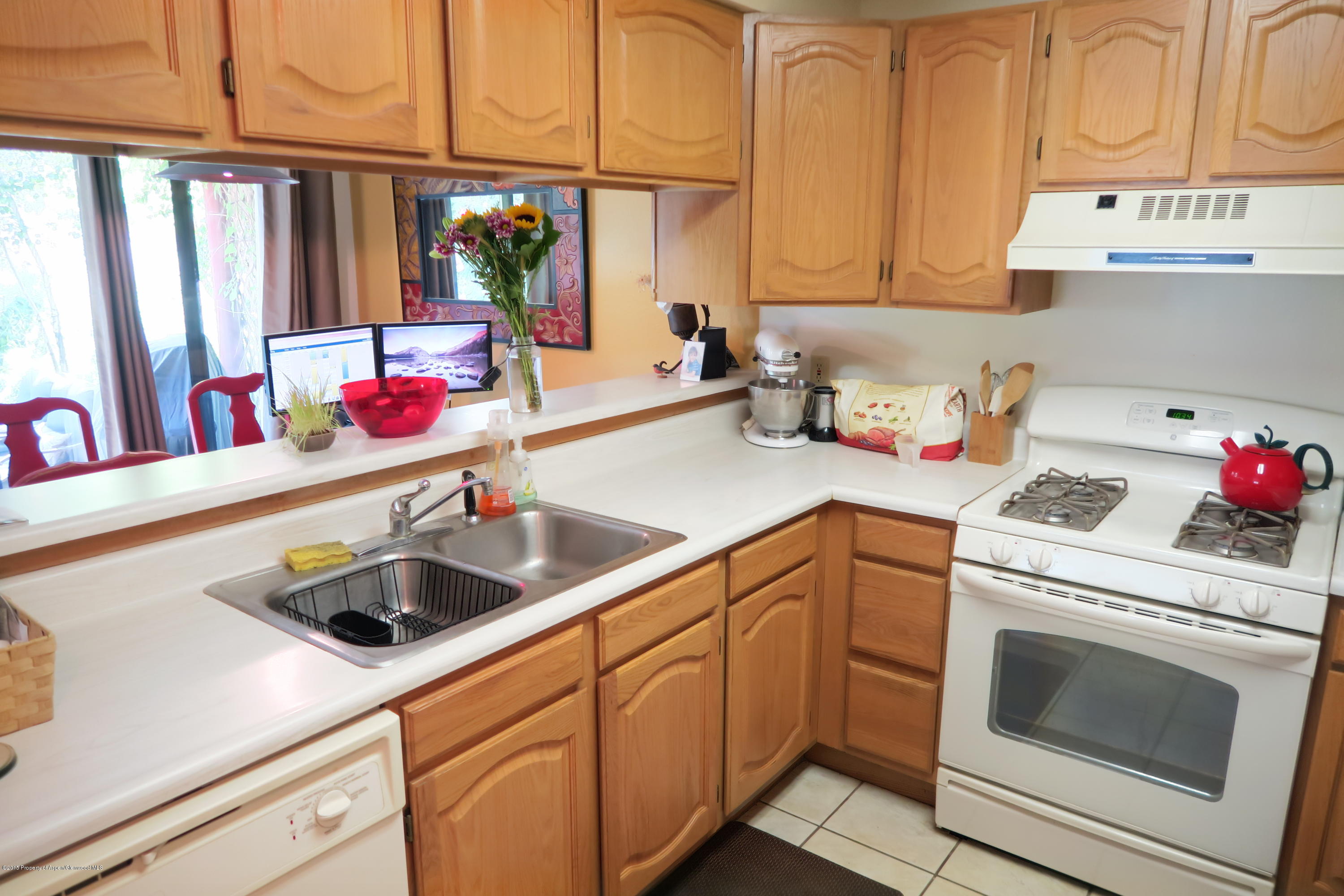 105 Silverado Drive Basalt, CO 81621 - Photo 7 of 13 a kitchen with sink cabinets and utility