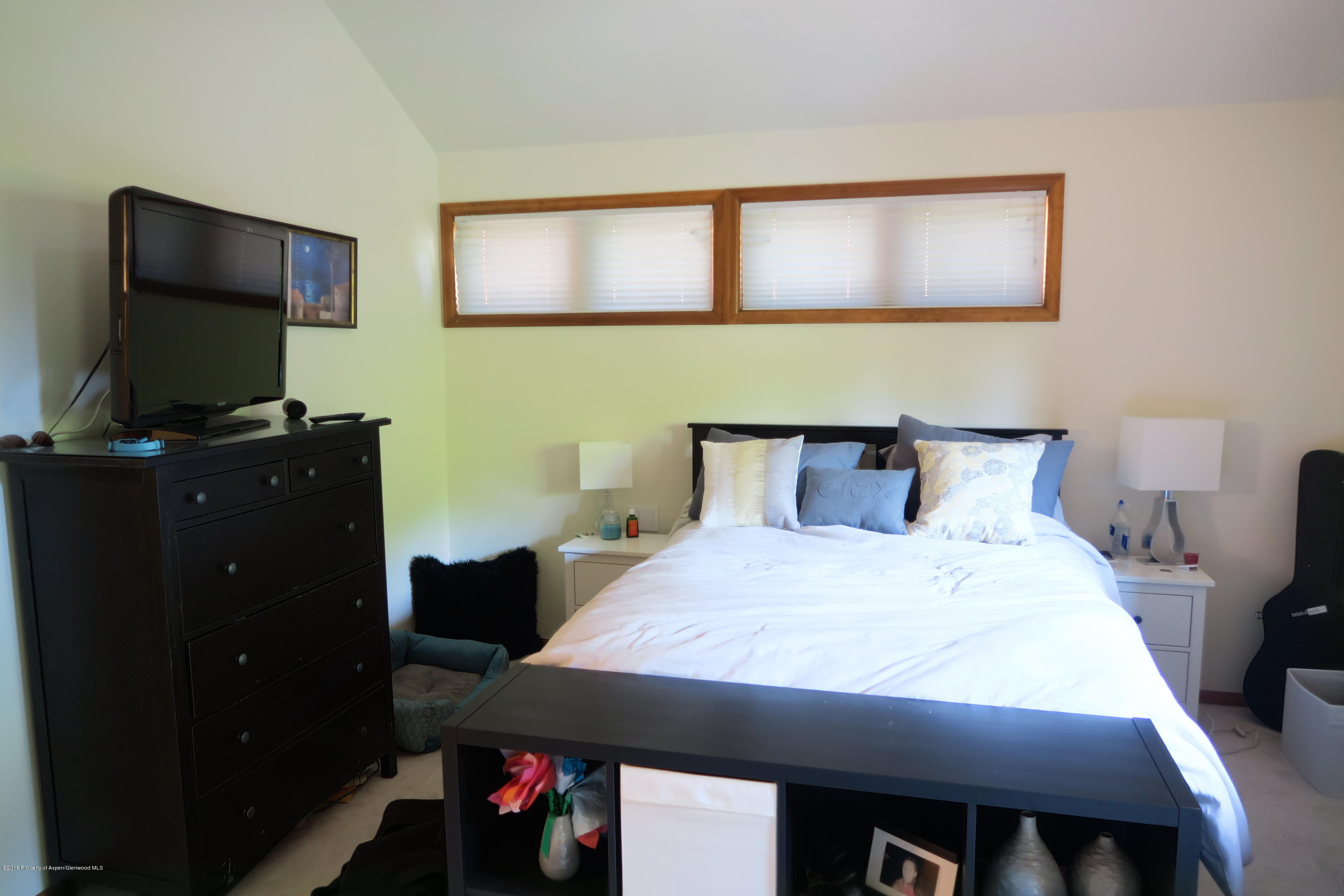 105 Silverado Drive Basalt, CO 81621 - Photo 9 of 13 a bedroom with a bed and a flat screen tv