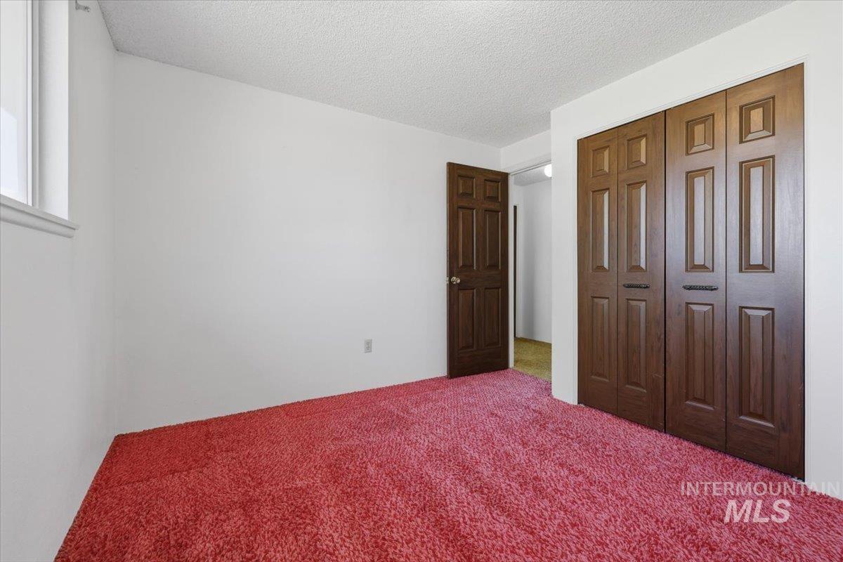 1311 North Middleton Road Nampa, ID 83651 - Photo 32 of 49 Interior space featuring red shag carpet and white painted walls