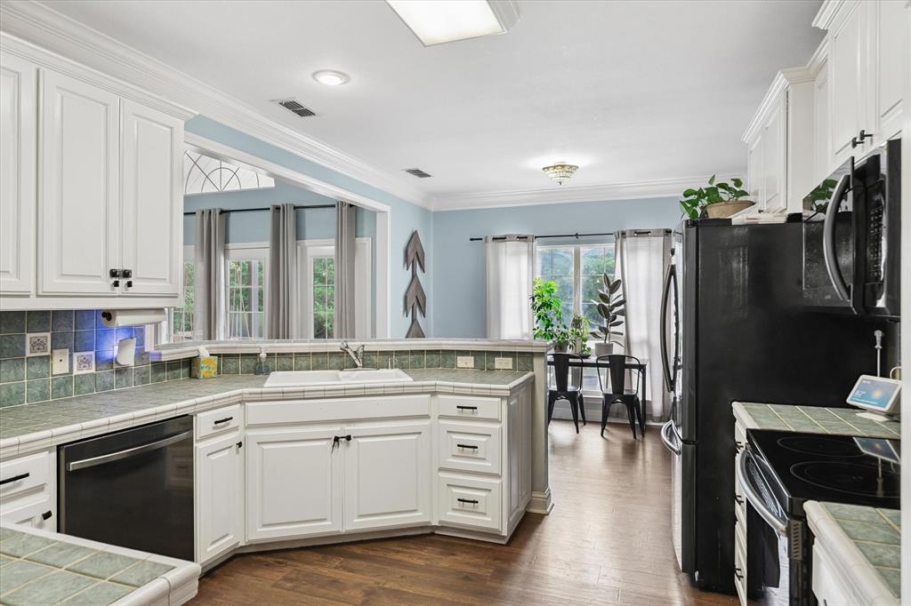 176 County Road 3282 Quitman, TX 75783 - Photo 12 of 35 a kitchen with a stove a sink and a refrigerator