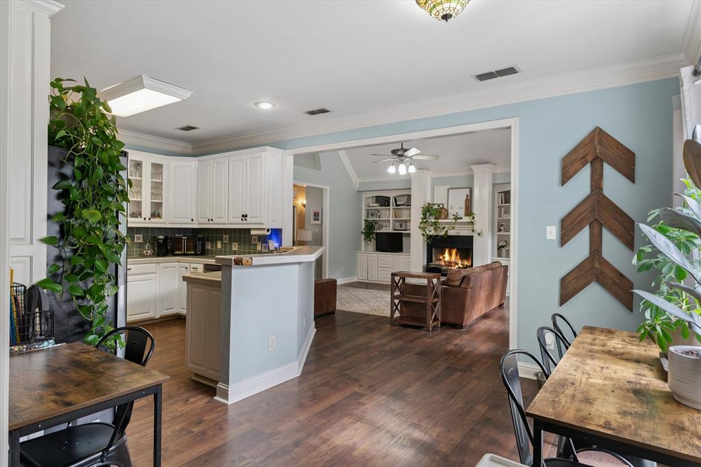 176 County Road 3282 Quitman, TX 75783 - Photo 14 of 35 a kitchen with a table chairs refrigerator and cabinets