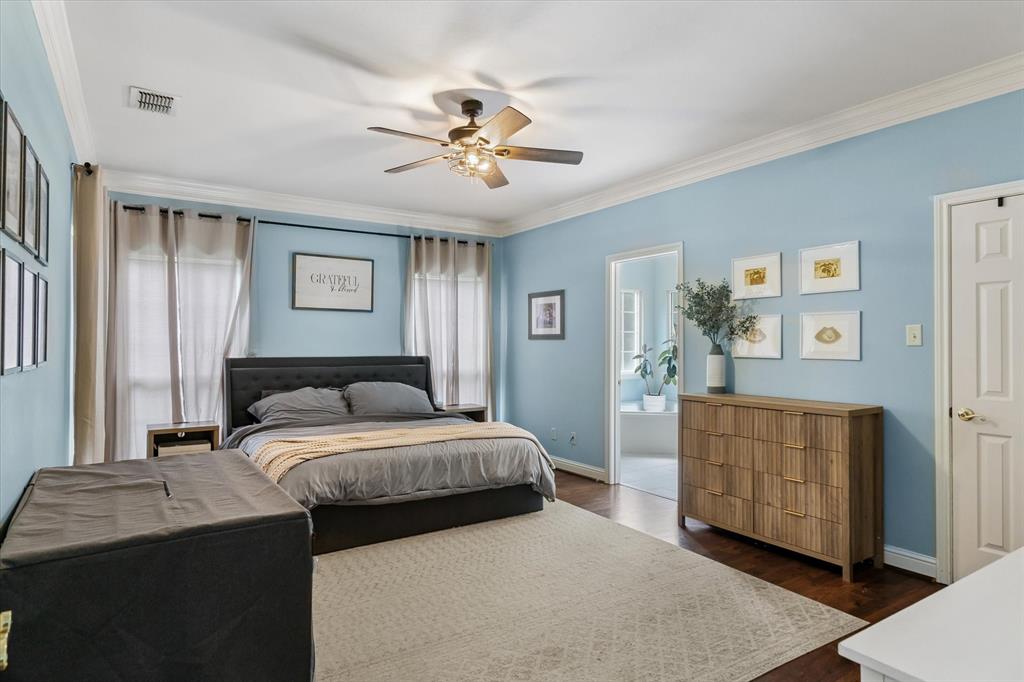 176 County Road 3282 Quitman, TX 75783 - Photo 16 of 35 a bedroom with a bed and a chandelier