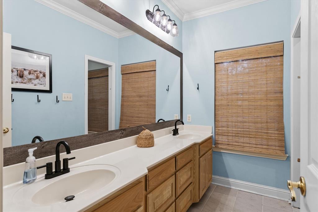 176 County Road 3282 Quitman, TX 75783 - Photo 21 of 35 a bathroom with a sink and a mirror
