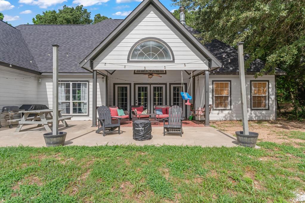176 County Road 3282 Quitman, TX 75783 - Photo 28 of 35 a view of a house with backyard porch and sitting area
