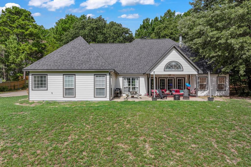 176 County Road 3282 Quitman, TX 75783 - Photo 29 of 35 a front view of a house with garden