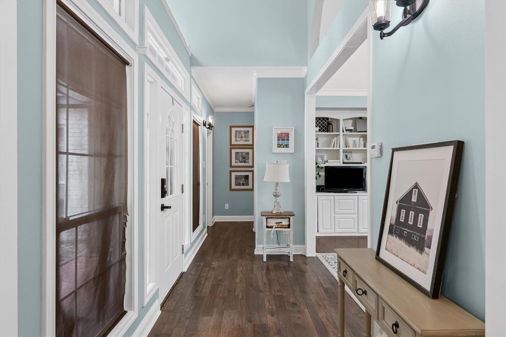 176 County Road 3282 Quitman, TX 75783 - Photo 3 of 35 a view of a hallway with wooden floor and furniture