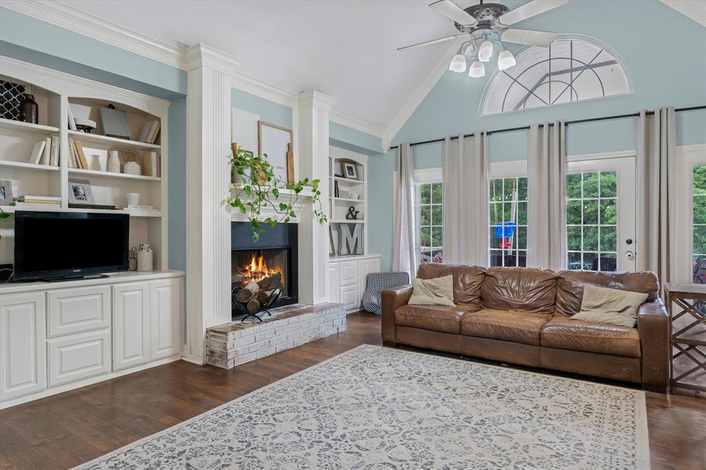 176 County Road 3282 Quitman, TX 75783 - Photo 6 of 35 a living room with furniture a flat screen tv and a fireplace