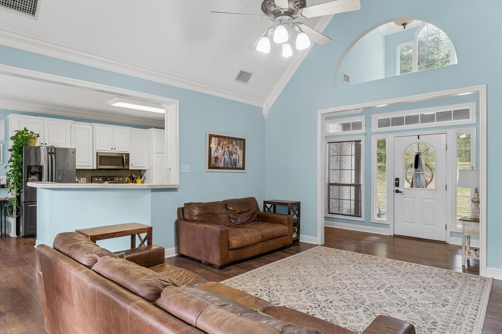 176 County Road 3282 Quitman, TX 75783 - Photo 8 of 35 a living room with furniture and a rug