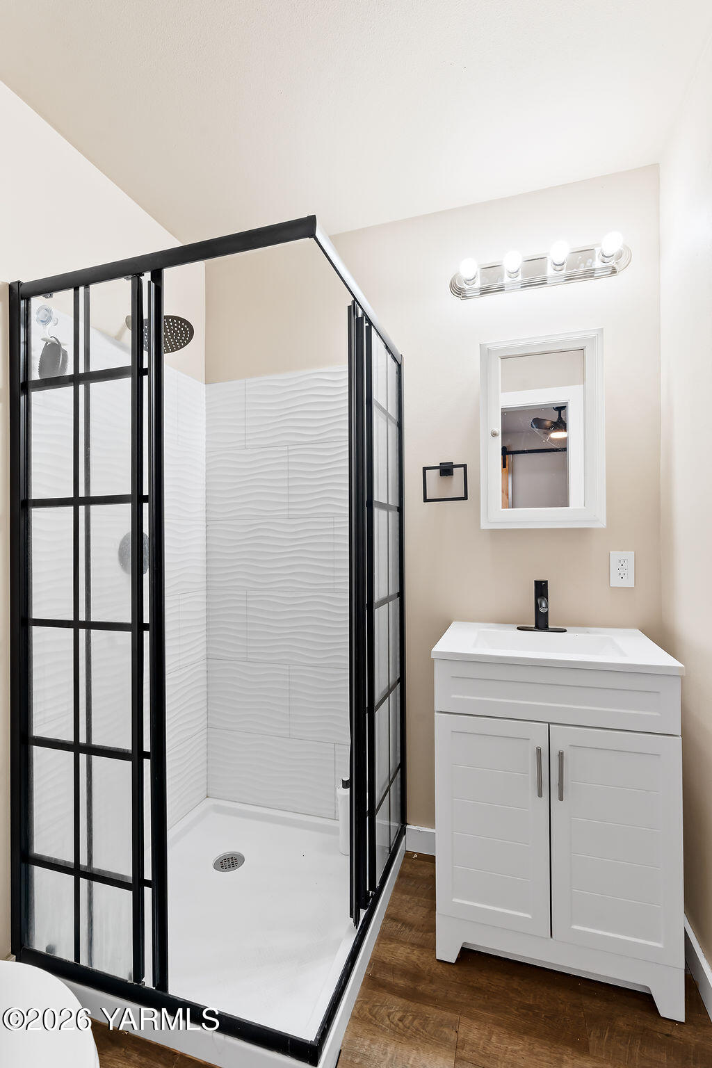 603 Cornell Avenue Yakima, WA 98902 - Photo 17 of 25 a bathroom with a shower sink and mirror