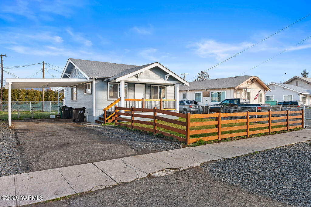 603 Cornell Avenue Yakima, WA 98902 - Photo 2 of 25 a front view of a house with a yard and fence