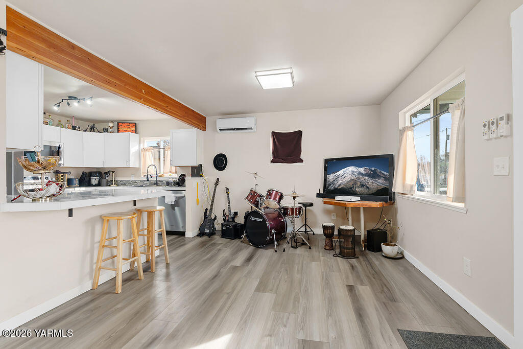 603 Cornell Avenue Yakima, WA 98902 - Photo 8 of 25 a living room with furniture and a wooden floor