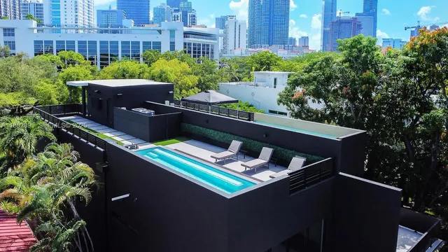 a view of a backyard with sitting area