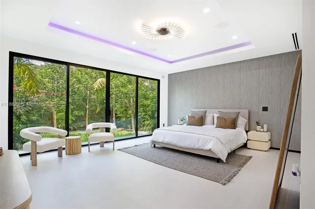 a view of a house with swimming pool and sitting area