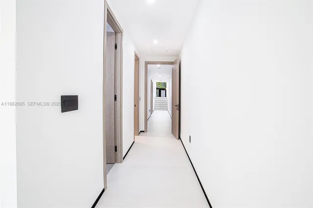 an aerial view of a house with a yard and outdoor seating