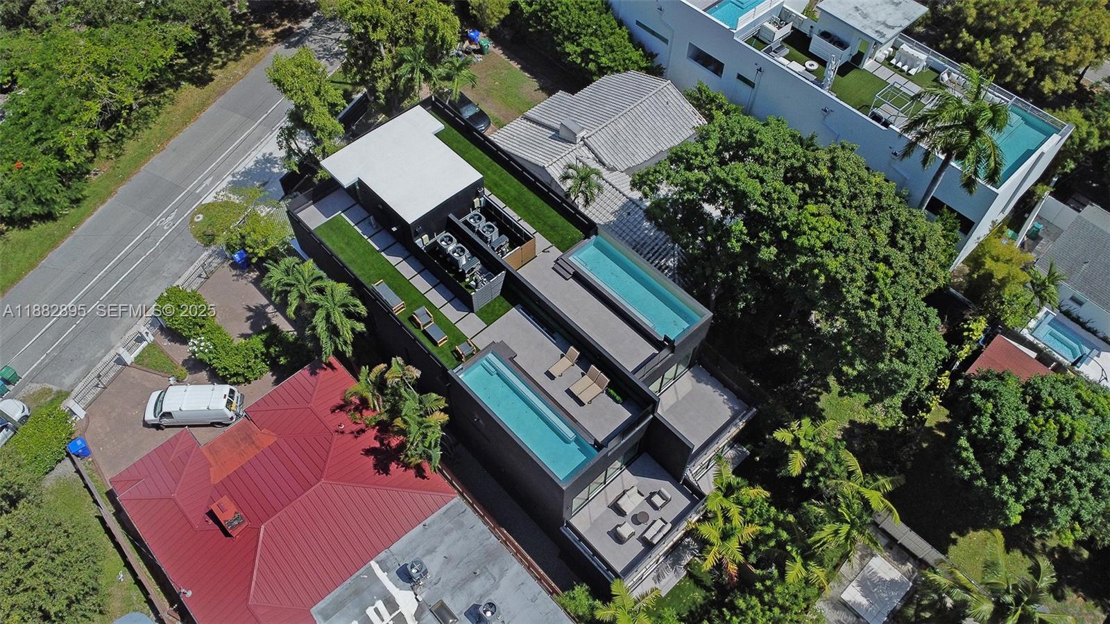 420 Southwest 15th Road Miami, FL 33129 - Photo 87 of 99 an aerial view of a house with a yard and outdoor seating